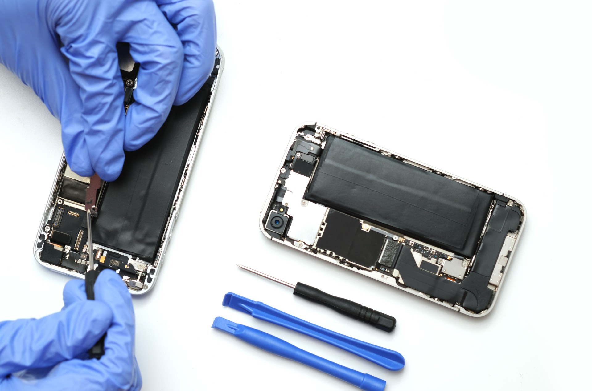 Technician Repairing Iphone Parts And Tools For Recovery Repair Smartphone And Upgrade Technology.